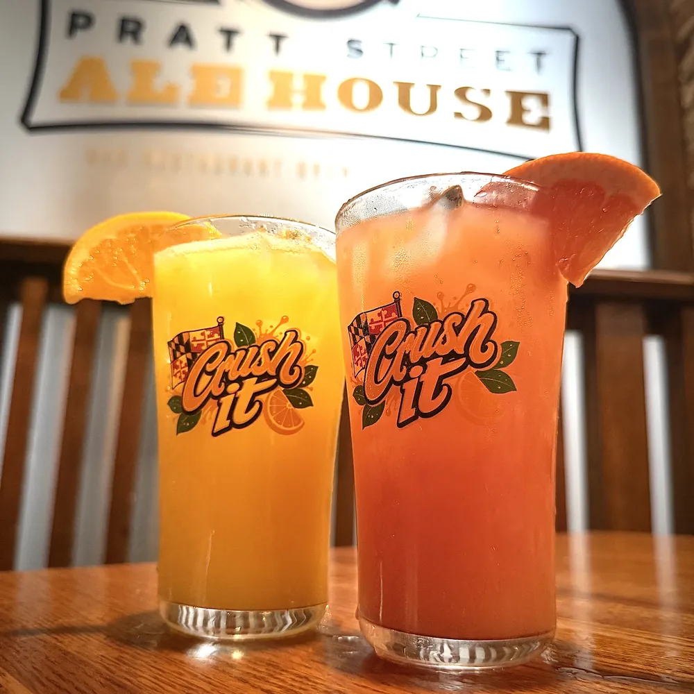 Two crushes in Crush It glasses under the Pratt Street Ale House sign