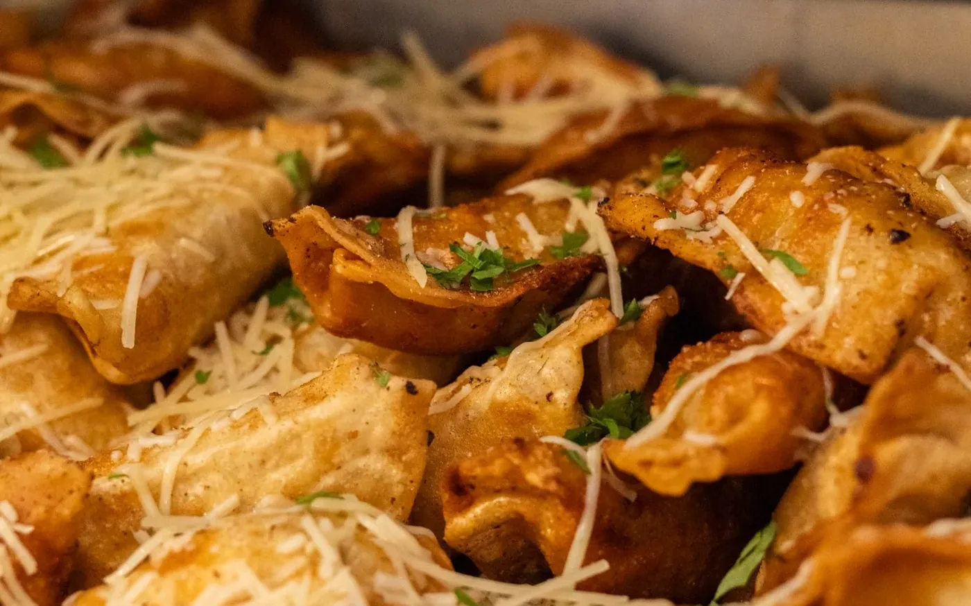 Fried pierogi with parmesan