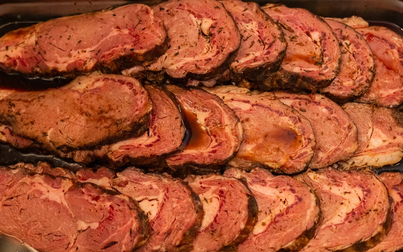 Carved prime rib on a catering tray