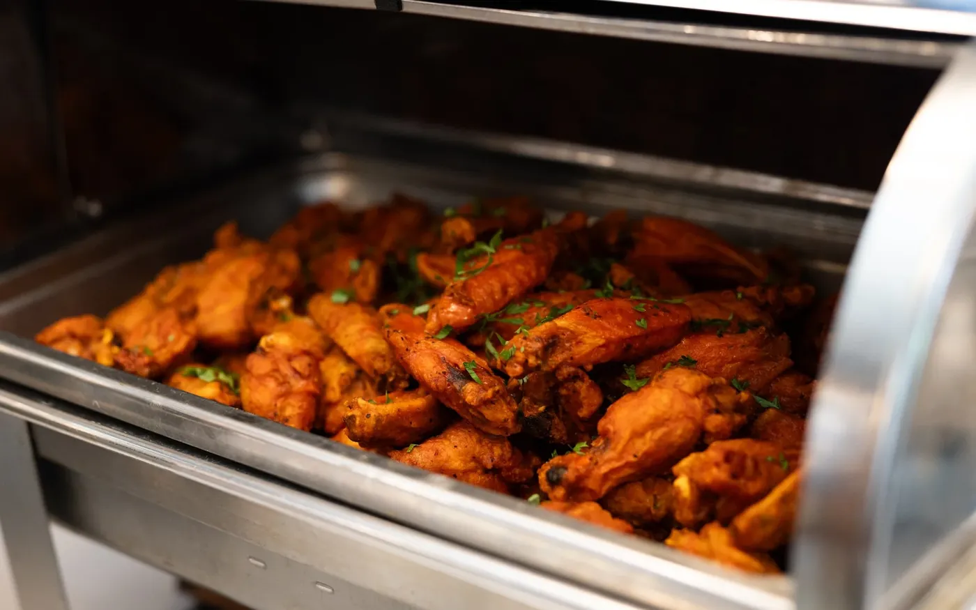 A tray of wings on the buffet