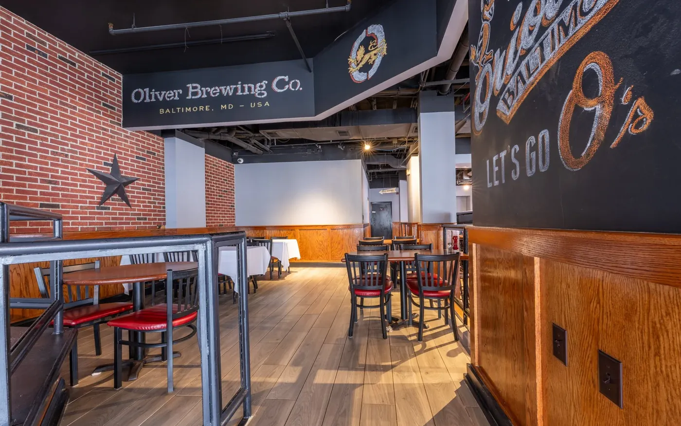 Seating under the Oliver Brewing Co. wall